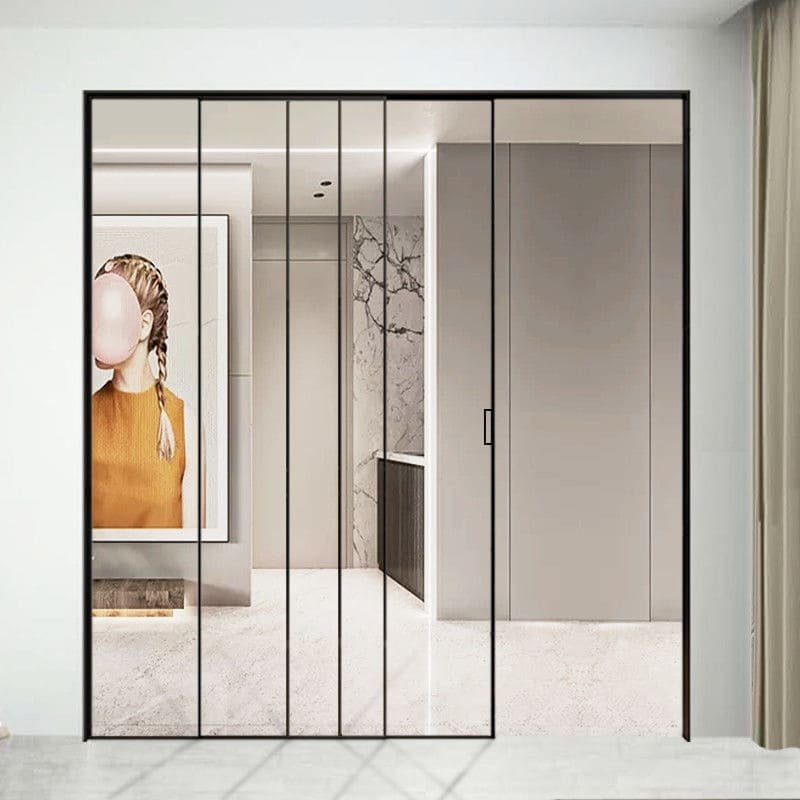 A modern living room with a large glass sliding door opening to a patio.