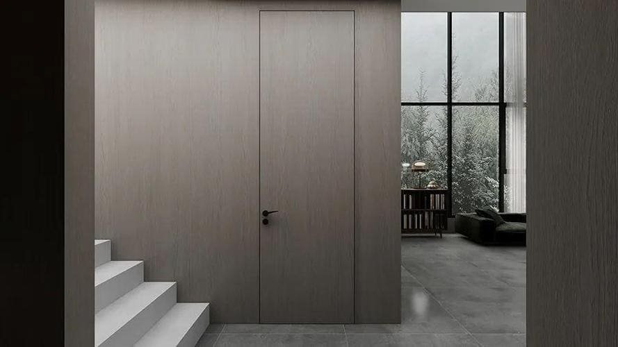 A wall with a completely flush and invisible hinged door
