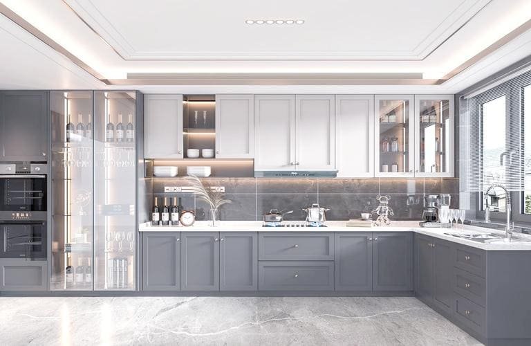 A kitchen with dark cabinets and light colored walls to create contrast
