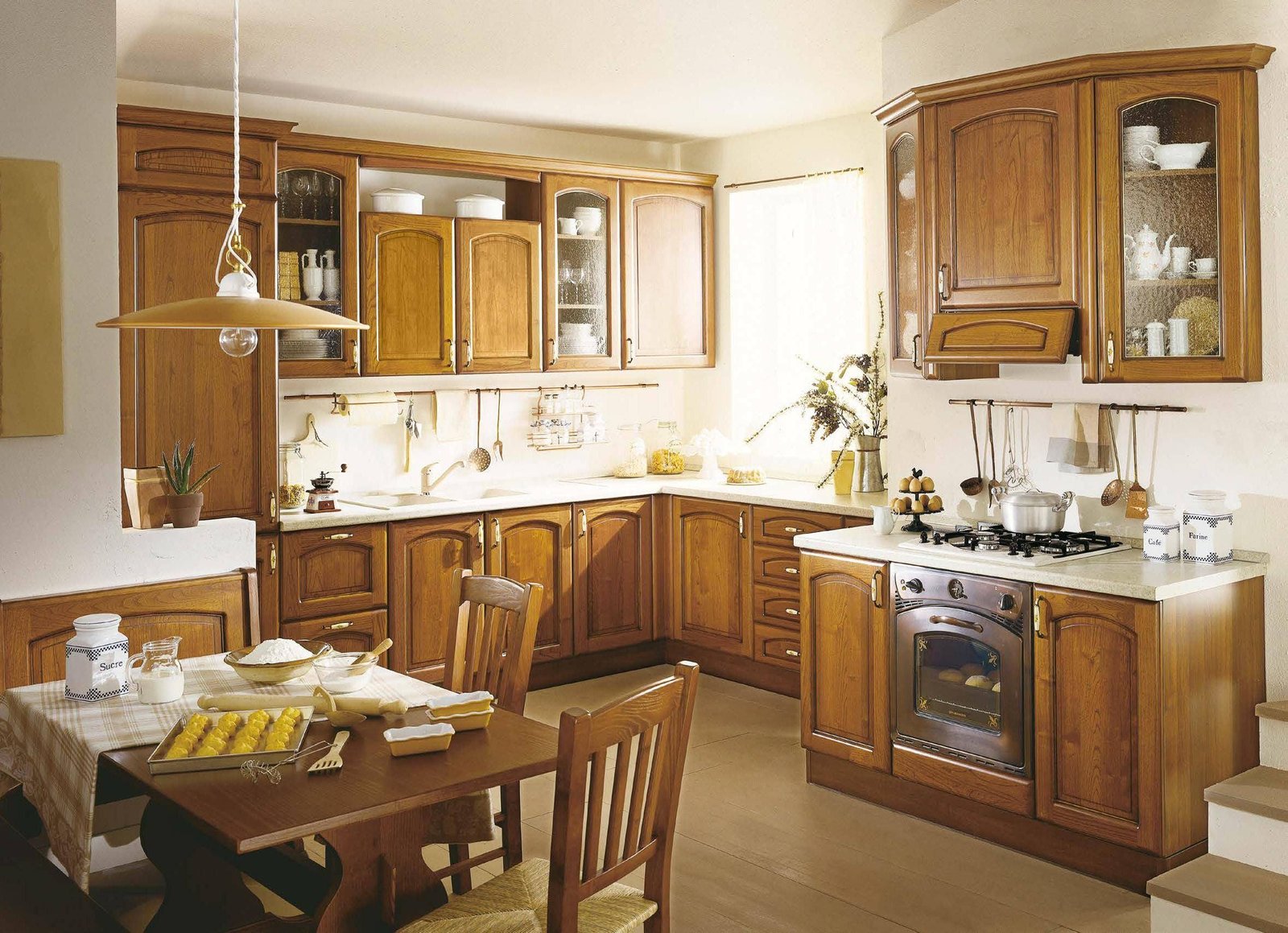 An outdated kitchen with honey oak raised panel cabinets