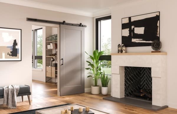 Wood planks and tools laid out for building a custom barn door