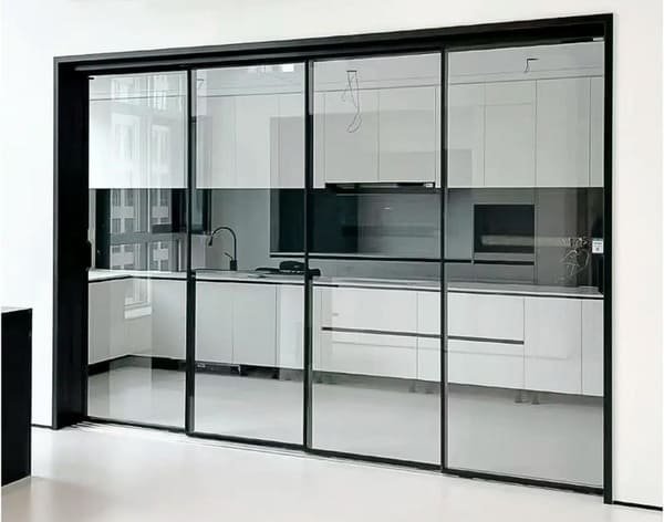 Close-up of a top-hung sliding door track and rollers