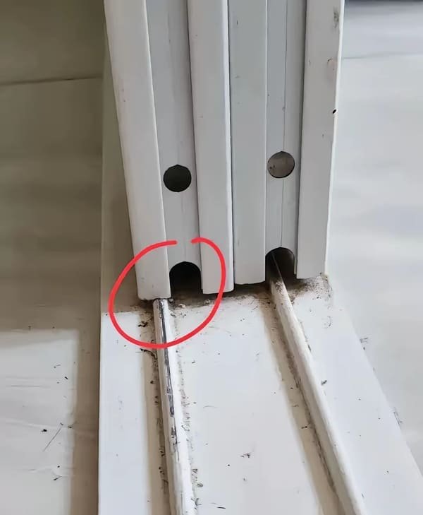 A frustrating image of a pocket door that has come off its track.