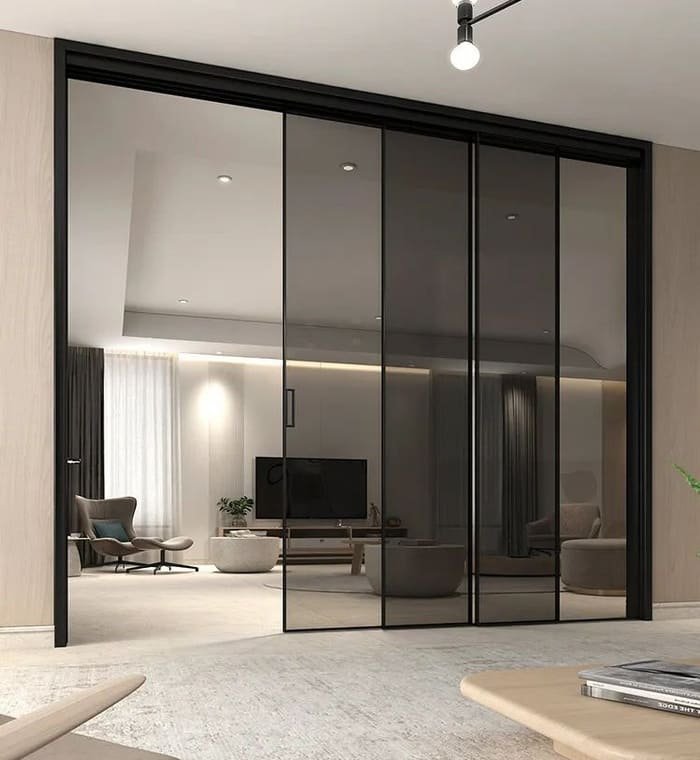 A modern hanging sliding barn door with a visible top track