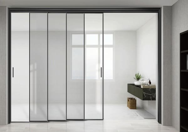 A modern living room with a large, clean sliding glass door