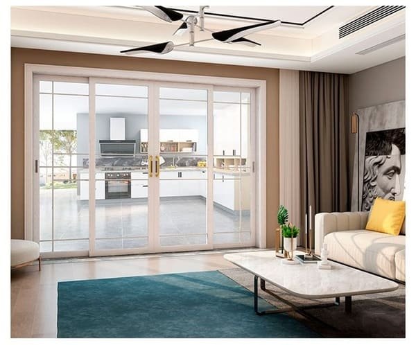 A thick, heavy soundproof curtain hanging over a sliding glass door.