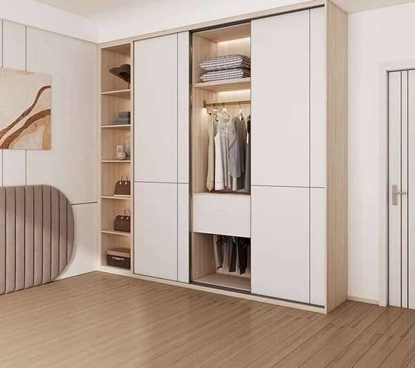 A person looking into a sliding door wardrobe, with one side completely hidden by the other door