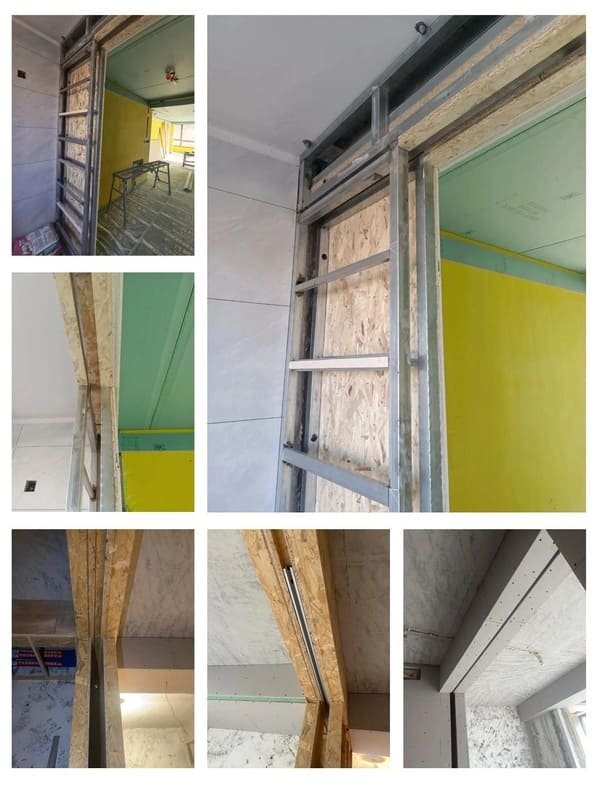 Close-up of a heavy-duty pocket door roller on a track.