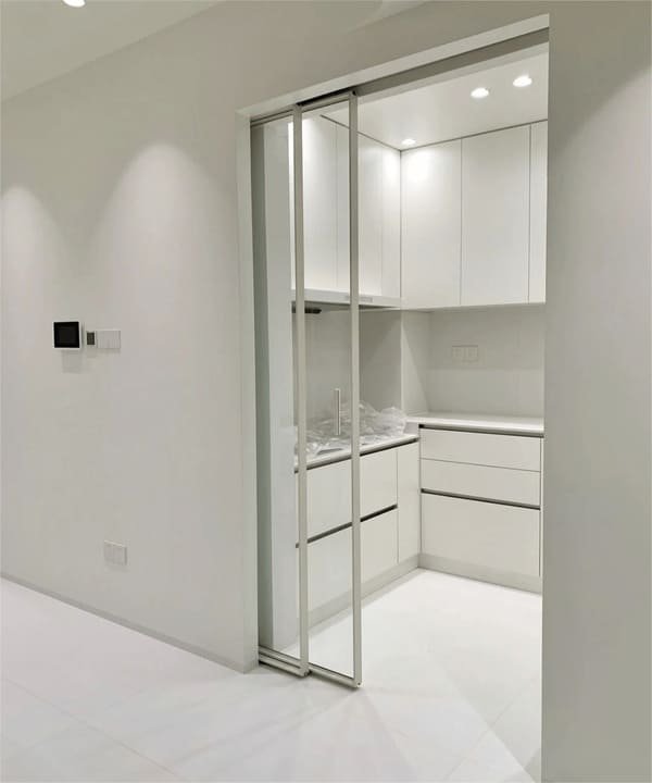 A close-up view of a floor guide for a pocket door.