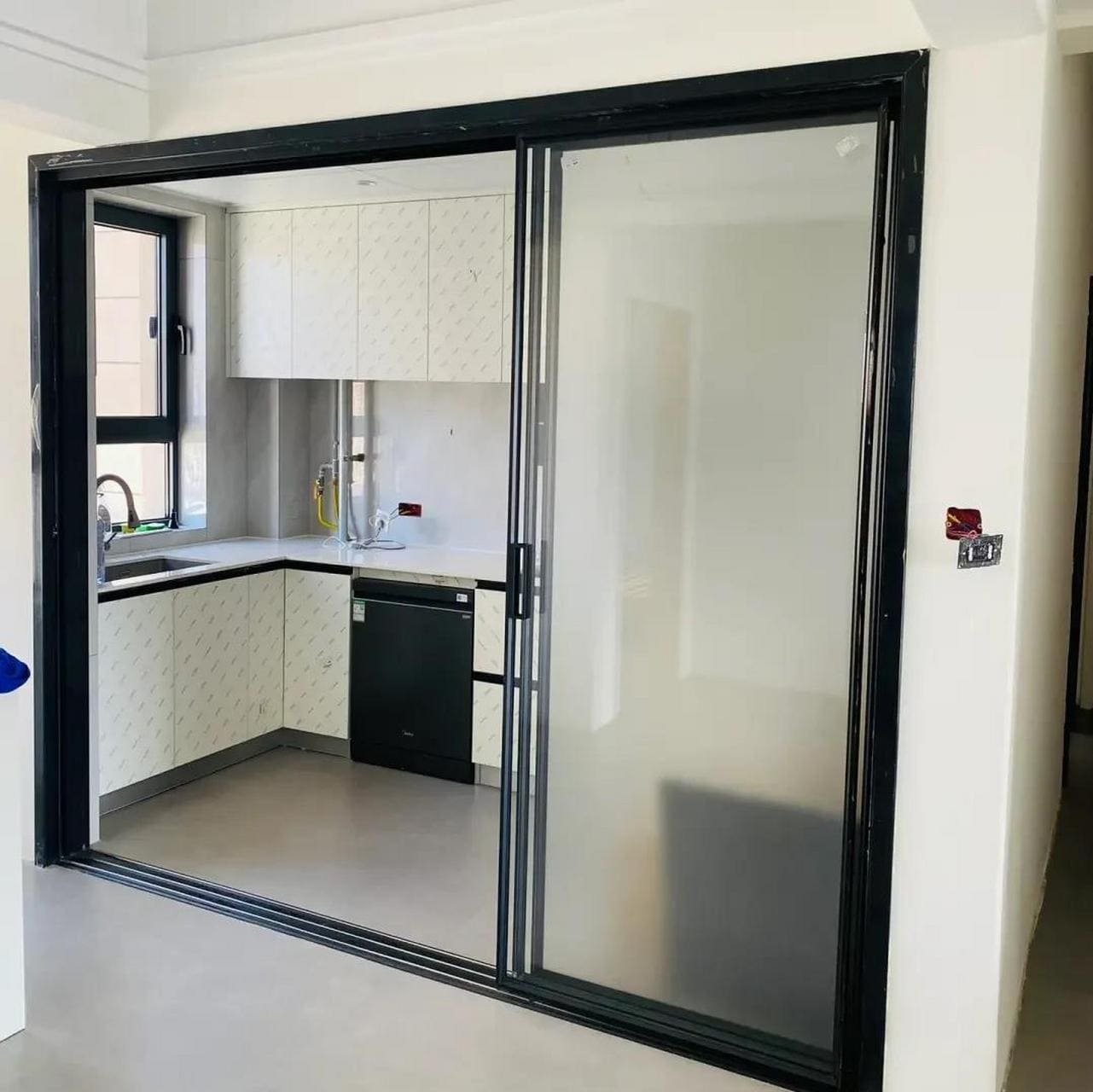 Recessed sliding door track flush with the floor, creating a seamless transition