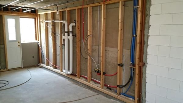A diagram showing plumbing and electrical wires inside a wall, indicating a bad spot for a pocket door.