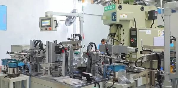 The opensliding factory with green energy symbols and a quality check station