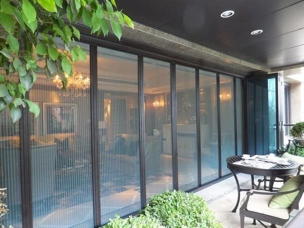 A close-up view of a high-quality screen mesh on a patio door