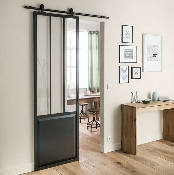 An empty doorway with trim, prepped for a barn door installation