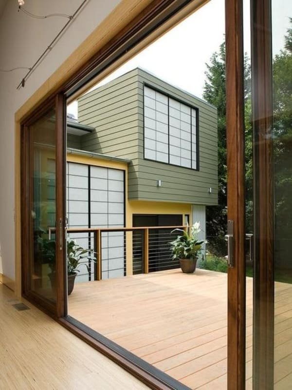 A patio door roller next to a measuring tape to show its dimensions