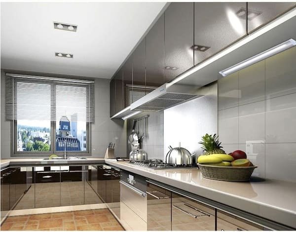 A modern kitchen cabinet with integrated LED under-cabinet lighting and in-drawer lighting.