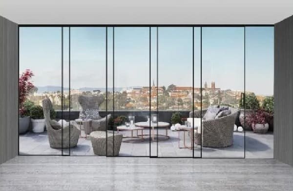 A close-up of different metal finishes for sliding door rails