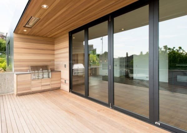 A modern, sleek, and thick soundproof sliding door installed in a home office.