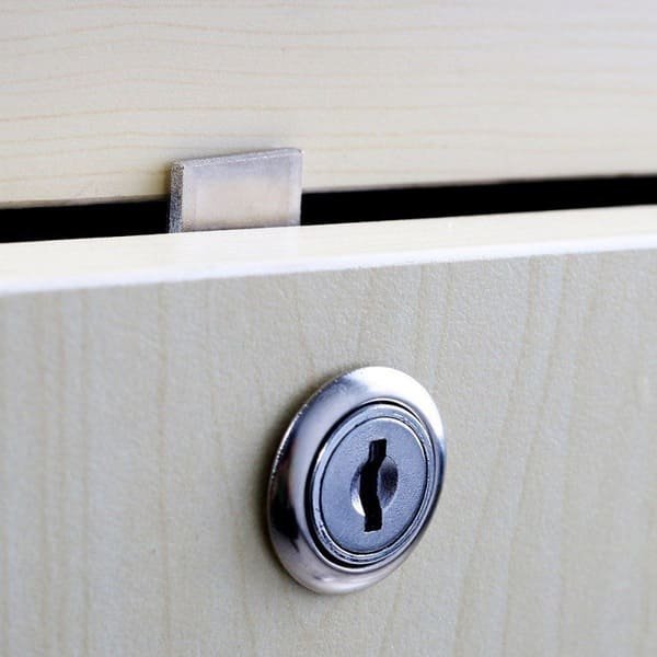 A round push lock on an RV cabinet door
