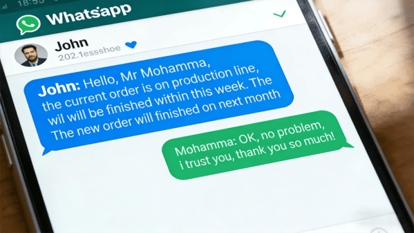 A person checking updates on their phone and laptop